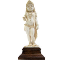 Bejeweled Child (?) Ivory Figure on Wooden Base