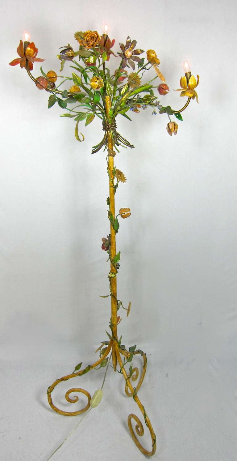 Gorgeous  Floral Bouquet Tole Candelabra Floor lamp. Tulips, Roses, Lilly of the Valley and more! Climbing vine of flowers  from floor to bouquet..Stunning...difficult to capture in photograph. Has a dimmer switch.  Must have piece! 

62