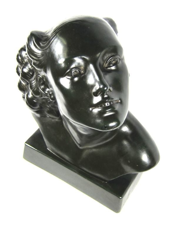 Featured is a 1940's female bust. It is dark green-black plaster-gibson. It is marked S.A.P. 1000. It is from the Czech Republic.<br />
<br />
Measures: <br />
15
