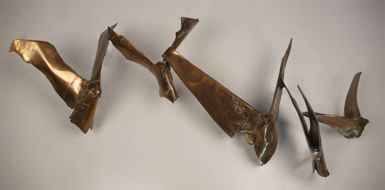 Solid cast bronze birds in flight wall mount sculpture by Israeli artist Susan Pogzeba.