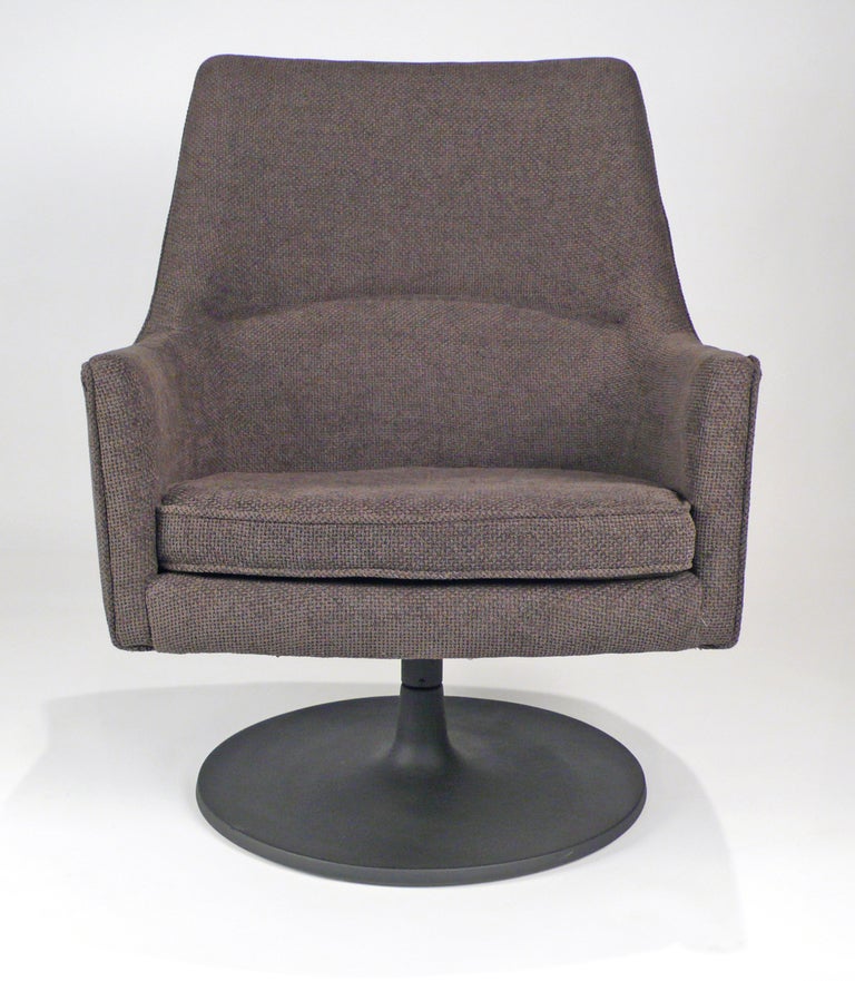 His swivel chair designed by Jens Risom. Her chair has sold.

