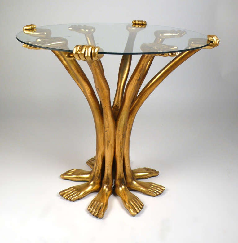 Gilt Mahogany hand and foot table by Pedro Friedeberg executed in the late 1960's. These early studio examples are easily distinguished from the later production pieces because they are much more delicate and detailed. This piece has a remarkable