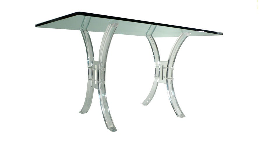 Solid Lucite Table would serve as an over-sized console, a writing desk or even a small breakfast table. This table has the same flair that is so appealing about many of Dorothy Thorpe's designs from the same period. This is a well constructed piece