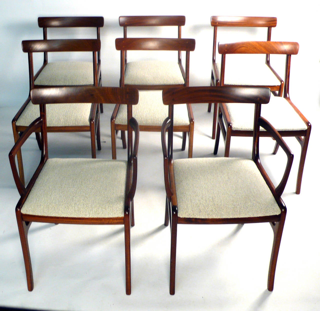 Set of eight Ole Wanscher dining chairs for Poul Jeppesen in solid ribbon Mahogany. 

Arm Chairs 30.5H x 20.5