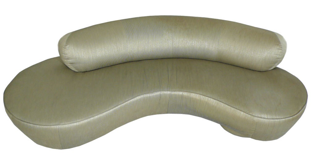 Sofa designed by Vladimir Kagan for Directional with original upholstery. Sofa sits on two circular bases with center acrylic support. The more pronounced circular end is on the left side if you are facing the sofa. Retains original Directional