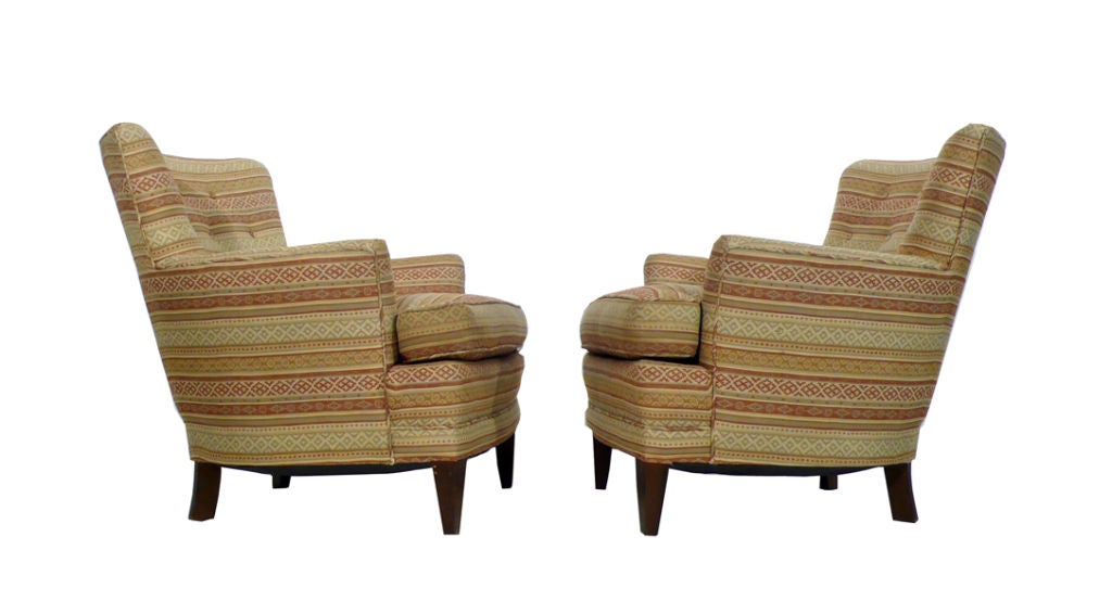 Classic Pair of 1960's Baker Club Chairs with generous proportions. These chairs are exceptionally well built and are ready to use as-is or would be suitable for re-upholstery in your choice of material. The hand tied springs provide a great amount