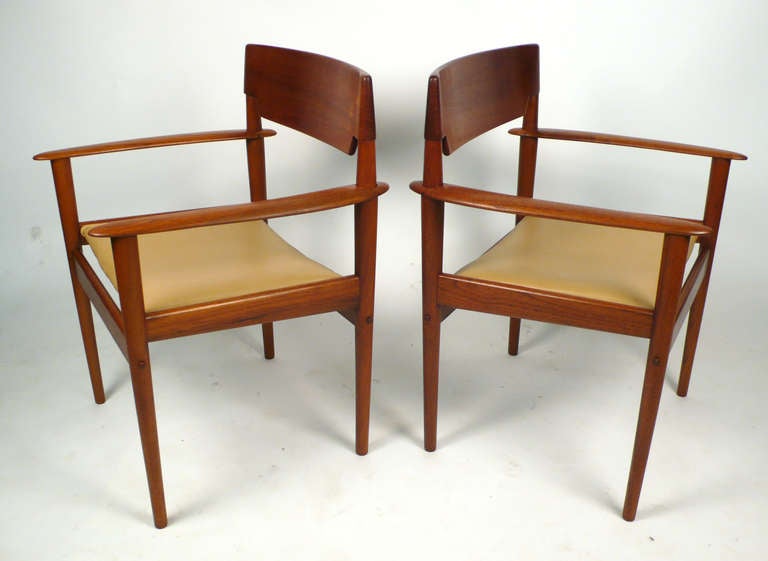 Pair of solid teak arm chairs designed by Greta Jalk for P. Jeppesen. Exquisite Danish Modern.