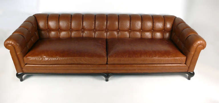 This luxurious biscuit tufted sofa was designed by Maurice Bailey for Monteverdi and Young of Beverly Hills. This particular piece rarely comes available is unquestionably one of the most well crafted leather sofas ever made, with no expense spared.
