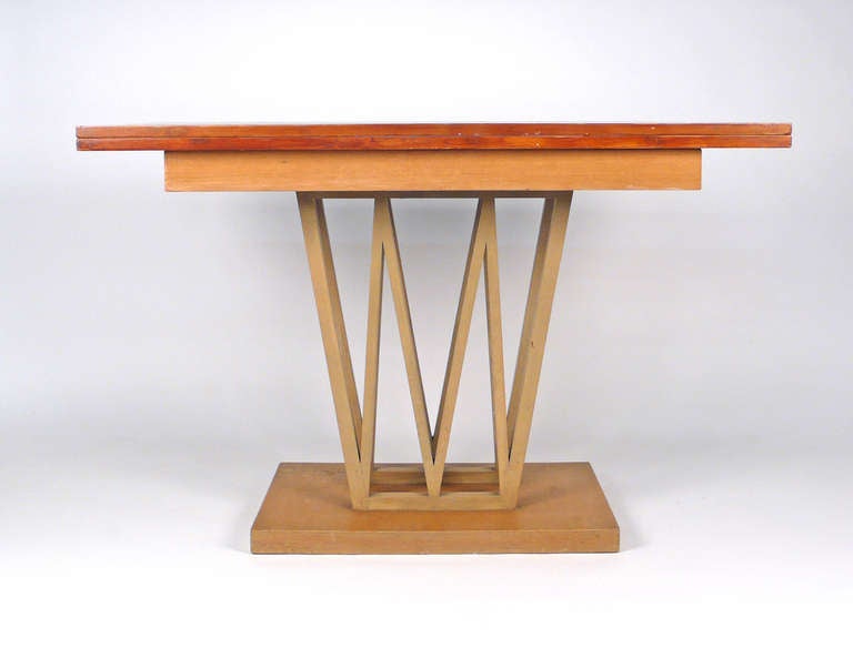 Very cool console table that could also be used as a dining table. Opens to 43.75 depth