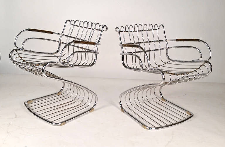 Rare pair of Gastone Rinaldi designed chairs for Rima of Italy. Very sexy chairs made from solid bar chrome plated steel.