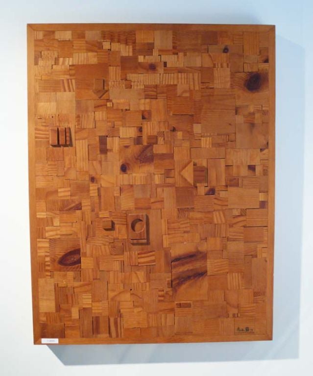 Modernist wood collage from 1973 signed Aoki. Sculpture consists of intricately cut pieces of wood inset on board.