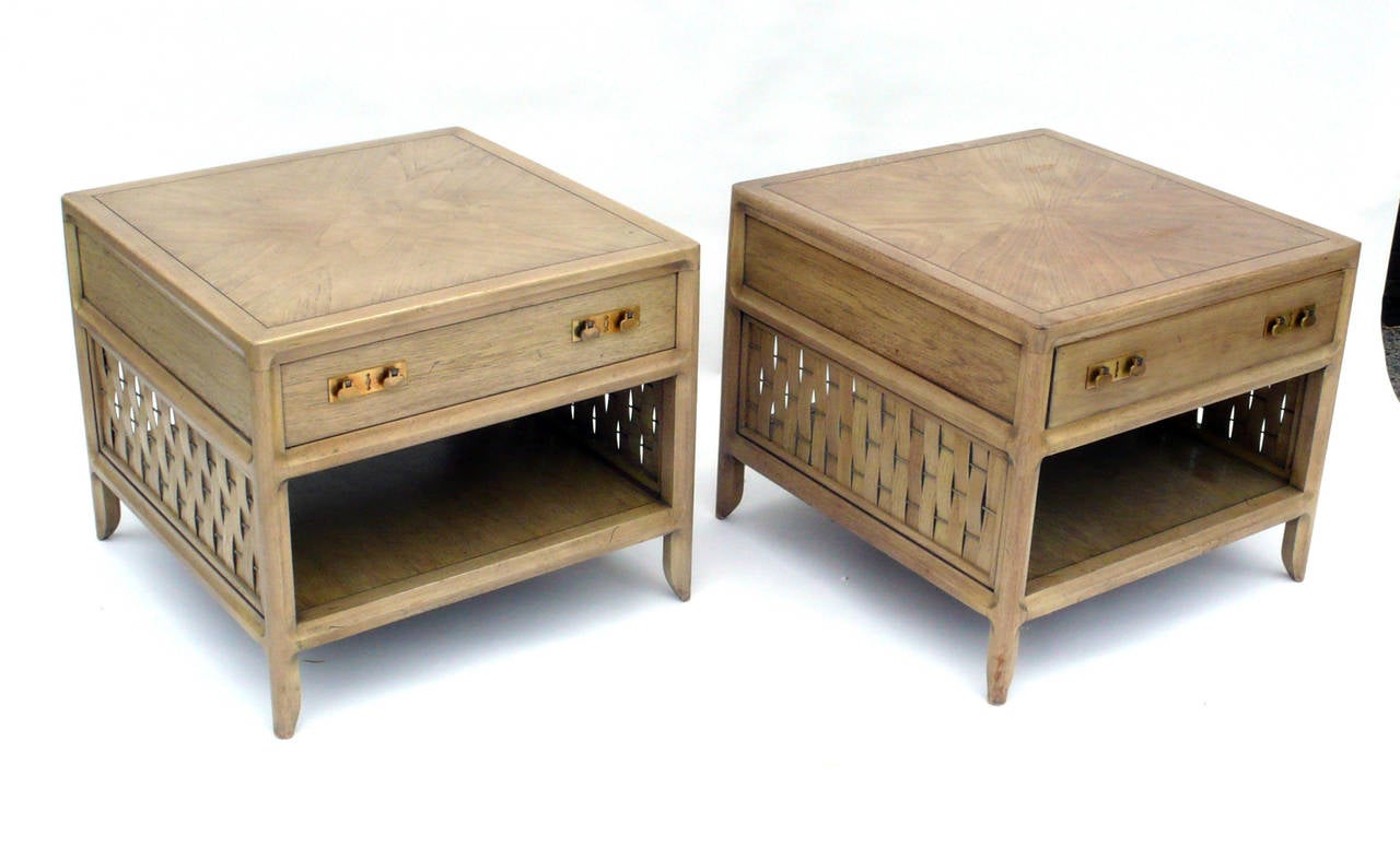 Large pair of vintage Baker nightstands with single drawer and woven sides. These are exceptionally well made as with all of the classic baker pieces.