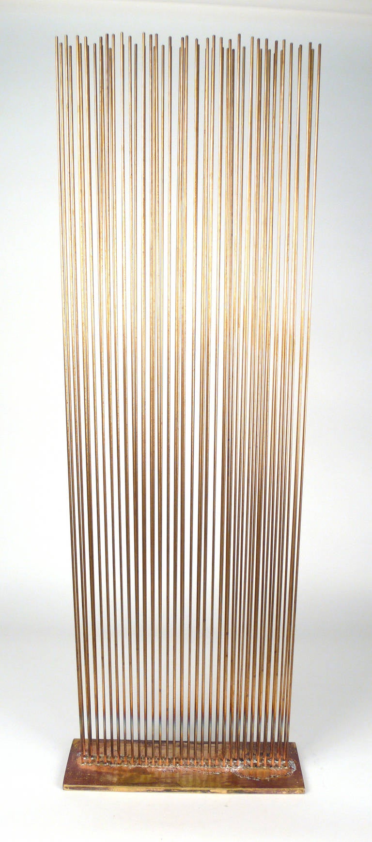 60 Beryllium-copper rods silvered to brass in V design. Sold with CoA.

This sculpture produces sound.