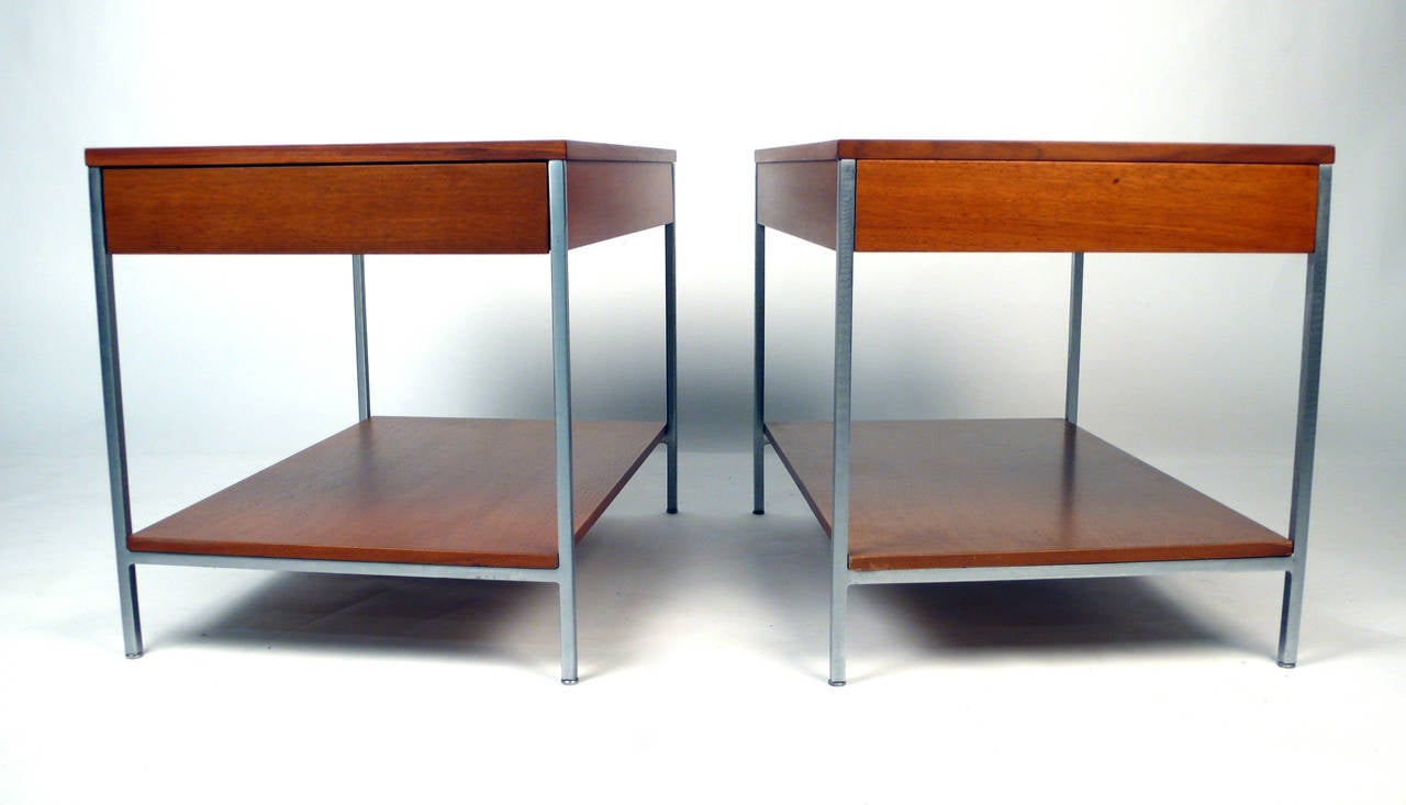 Beautifully proportioned, single-drawer end tables designed by George Nelson for Herman Miller. These would serve well as night stands in a bedroom or as side tables in a living space. They both retain all four original glides and the inside of one
