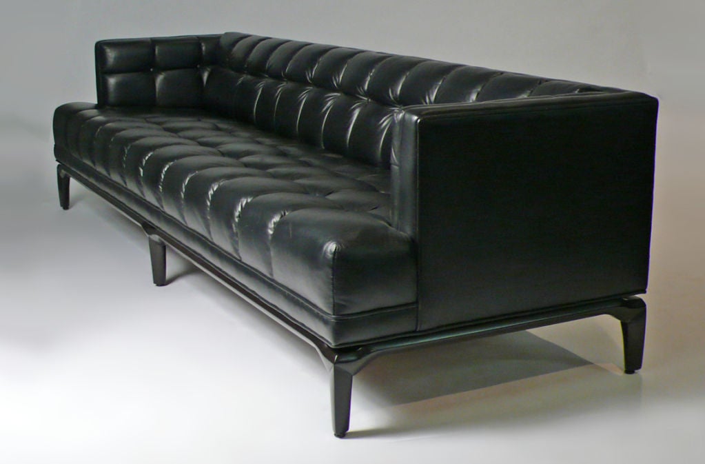 These luxurious biscuit tufted sofas created by Maurice Bailey for Monteverdi and Young were some of the most well crafted leather sofas ever made with no expense being spared. They were considered a status symbol amongst movie producers and