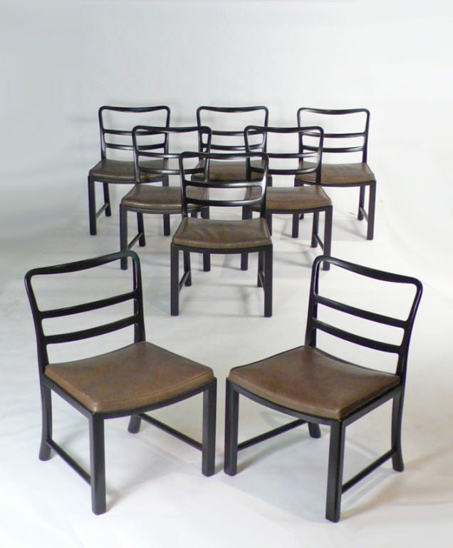 Set of eight Dunbar Dining chairs designed by Edward Wormley. Chairs have been refinished in a dark mahogany lacquer and recovered in an olive green leather complete with new foam. These chairs are ready to use.