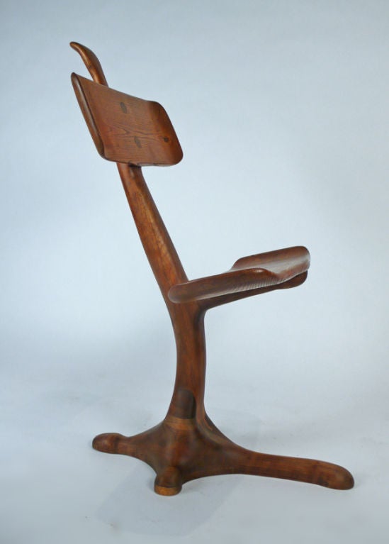 Masterfully constructed hand carved chair-sculpture from the California crafts movement. Possibly one of a kind. Unsigned. Very much in the style of Wendell Castle.