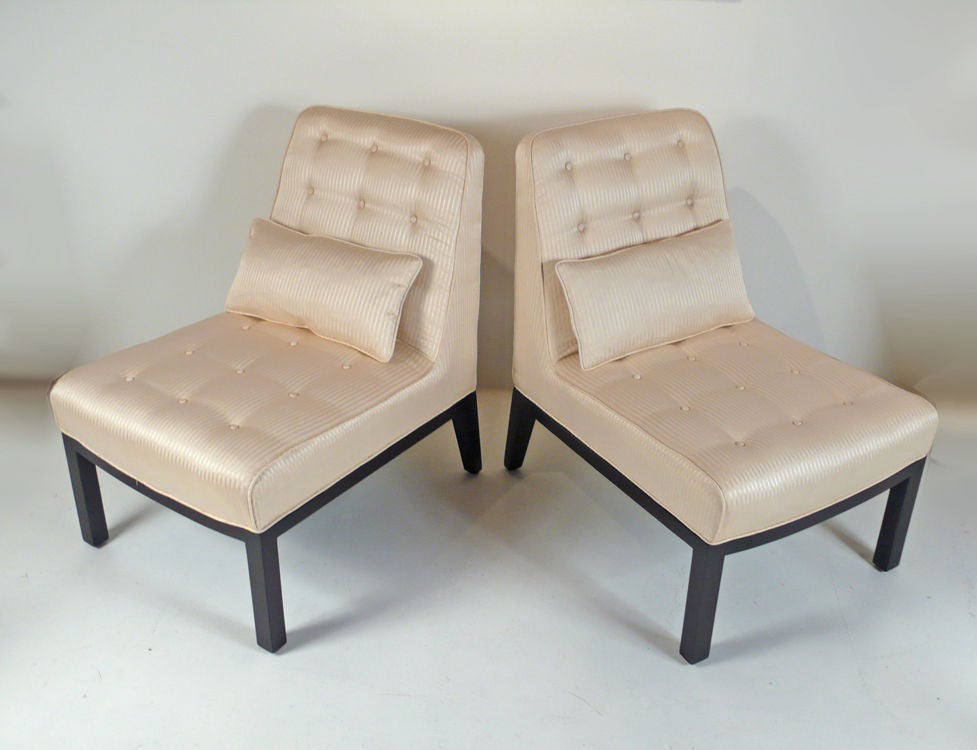 Beautiful pair of Slipper Chairs designed by Edward Wormley for Dunbar with down fill pillows. Excellent condition reupholstered in a silk with mahogany wood base.