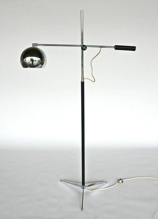 Tripod Floor Lamp in the style of Gino Sarfatti. The entire lamp is in great condition and all of the hardware works as intended. This is quite a gracefully functional lamp for reading.  The leather wrapped counter weight and well engineered