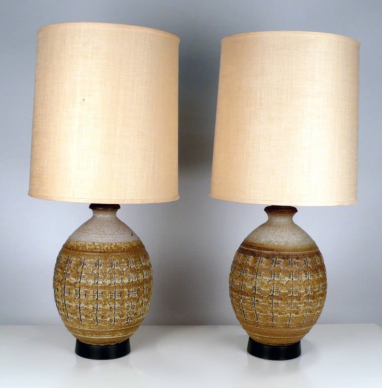 Ceramic lamps designed by Bob Kinzie with original shades. 30
