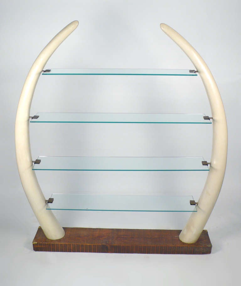 Faux elephant tusk etagere designed by Suzanne Dahl & Jerry Barich for the Versailles collection. Customized by the renowned Caruth family of Dallas for their trophy room with a solid pine beam.