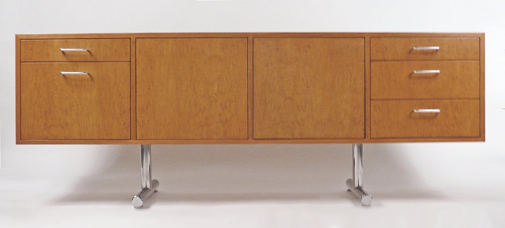 Credenza designed by Hans Eichenberger manufactured by Stendig International. Credenza is in excellent condition constructed with rift cut English Brown Oak and chromed plate steel. Back is finished and can free stand in a room.