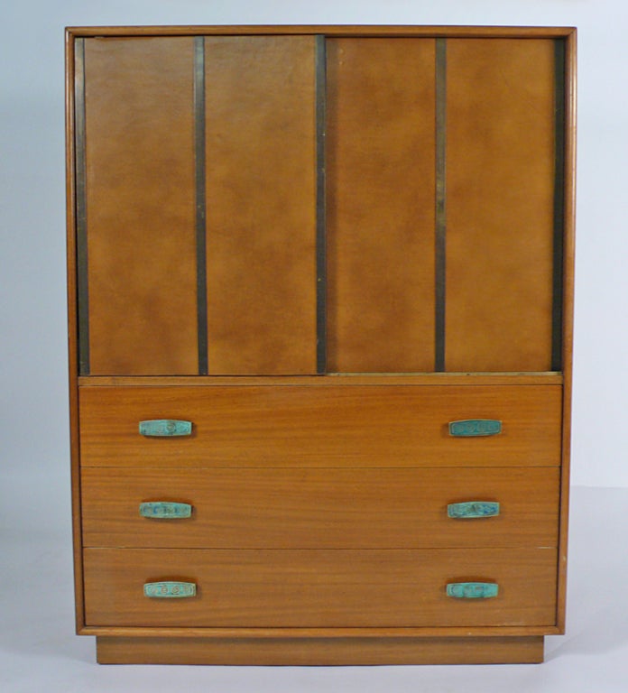 Unusual Gentleman's Chest designed by Harvey Probber.  Constructed with bleached mahogany, leather wrapped doors slide open to reveal white lacquer drawers. Chest has the original hardware by Pepe Mendoza and is in very good original condition.