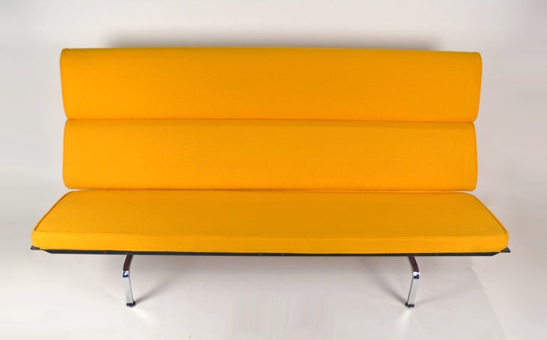 Early version compact sofa designed by Charles Eames for Herman Miller with original upholstery.