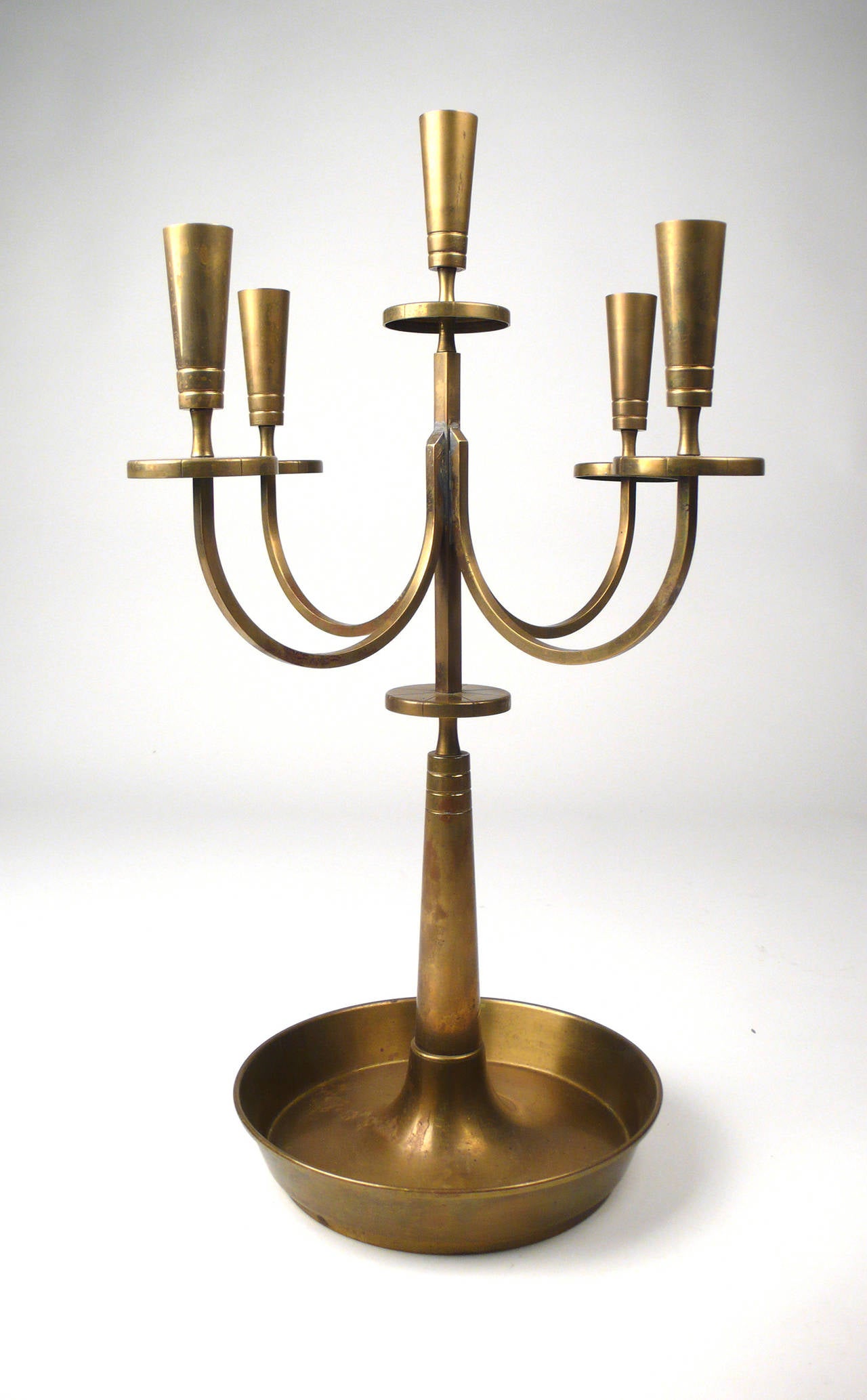 Signed Tommi Parzinger for Dorlyn Silversmiths solid brass candelabra, accommodates 5 candles.