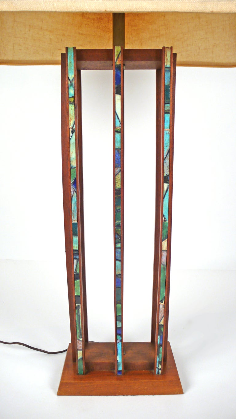Incredible, rare mid century modern studio made lamp designed by Harris Strong and crafted from teakwood with inlaid ceramic tile strips. We have a second complementary H. Strong lamp available separately. Shade not included.