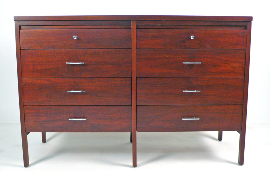 Exceptional Paul McCobb eight-drawer dresser with original hardware. Cabinet is signed with stamped manufacturer's mark. Complementary gentleman's chest available separately. Mahogany frame and walnut sides, drawer faces and rosewood tops with