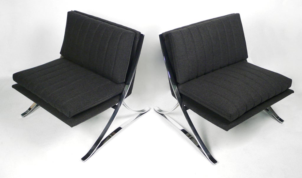 Pair of Mid-Century Modern lounge chairs designed by famed Canadian modernist Leif Jacobsen. The chairs have been recovered in a high grade, charcoal colored, felted wool textile. One chair retains original fabric label. This design was executed in