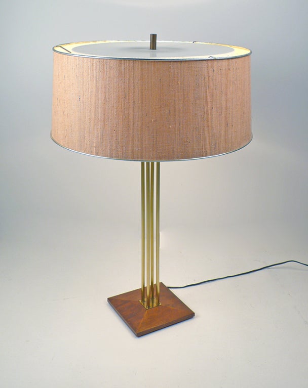 Exceedingly Rare and Early Lightolier table lamp with original foil trimmed grasscloth shade and both upper and lower diffusers intact. Three way switch works as intended. Design attributed to Gerald Thurston.