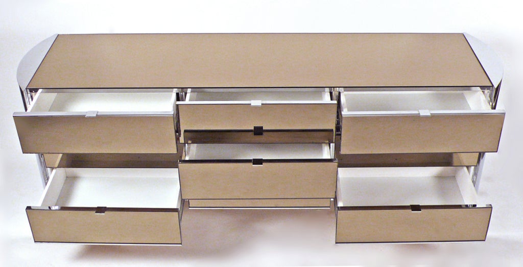 Nine Drawer Dresser by Ello with bronze mirror and chrome.
Matching chest for bedroom suite available.