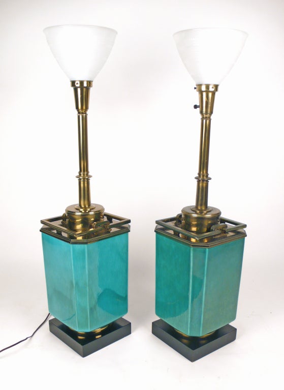 Monumental Jade blue colored ceramic table lamps with brass ornamentation and glass diffusers by Stiffel. Shades and finials are not included. One lamp has a slightly darker patina to some of the brass than the other.