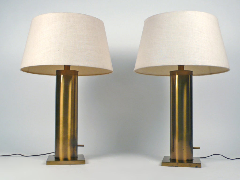 Pair of brass cylinder tables lamps by Stiffel.  Original shades, brass finials and perforated metal diffusers.