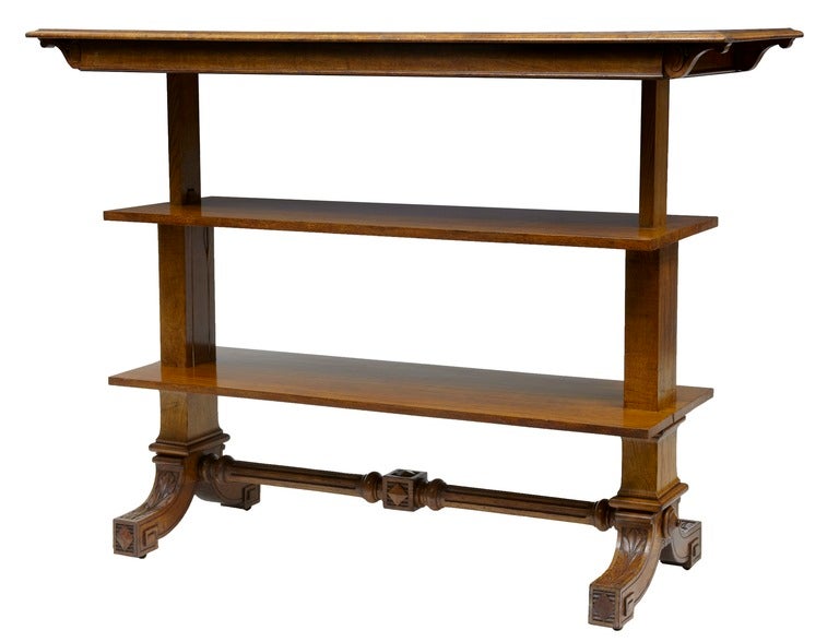 Rectangular Pollard Oak metamorphic buffet table of light rich colour.
This charming buffet expands into a practical three tier “dumb waiter” format (see photos) through a simple mechanism that operates smoothly by pulling the top