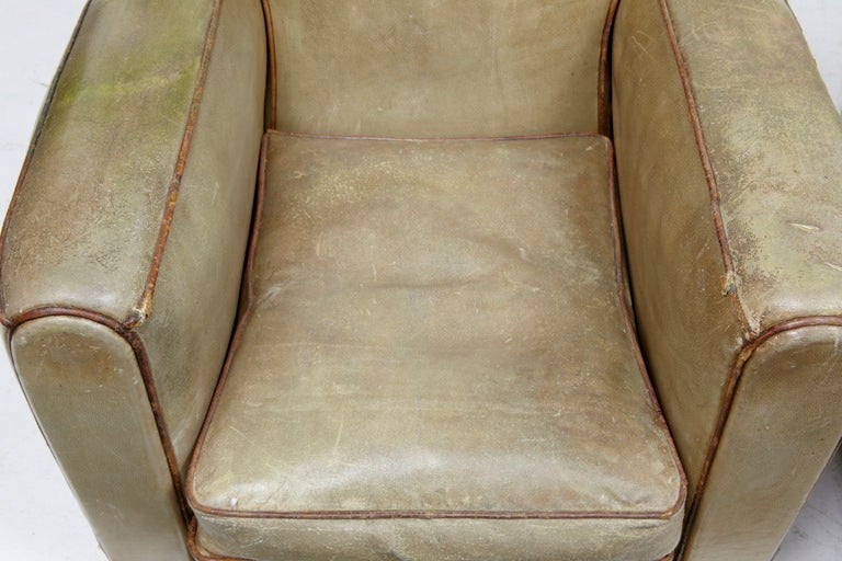 A FINE PAIR OF FRENCH LEATHER CLUB CHAIRS, IN ORIGINAL LEATHER. THE LEATHER IS WORN AND THE PIPING IS LOOSE IN A FEW PLACES BUT THESE CHAIRS ARE CERTAINLY DESIRABLE AS THEY ARE.

SEAT HEIGHT: 15