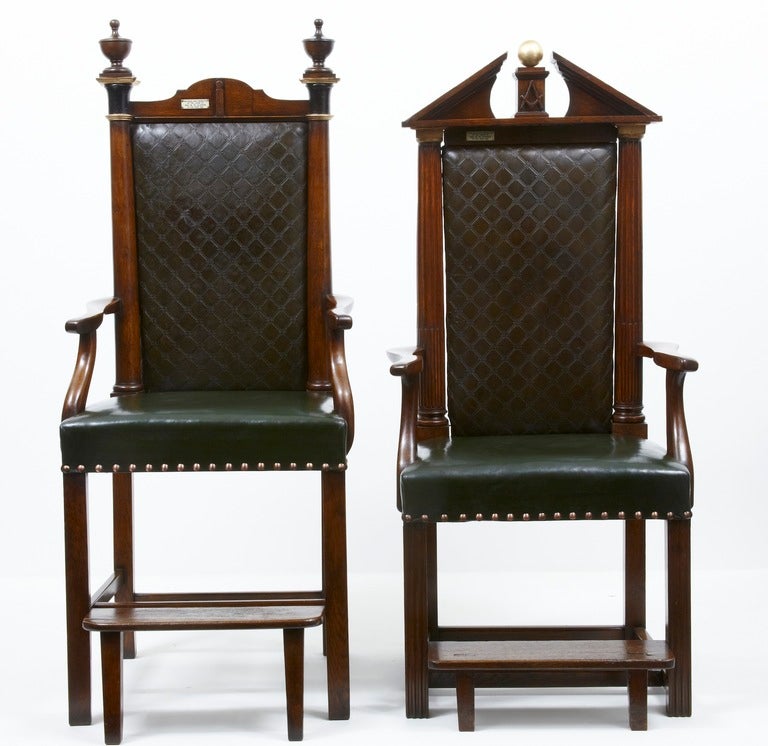 Here We Have A Rare Pair Of Masonic Oak Throne Chairs. One Featuring A High Back With Architectural Broken Pediment Crest Above Padded Back Flanked By Ionic Columns, Swept Open Arms, Stuffover Seat, On Square Section Legsunited By Stretchers And
