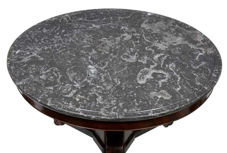 19th century French mahogany and simulated porphyry gueridon centre table

Stunning table on triform base standing on paw feet with castors.

Dished top marble has restoration.