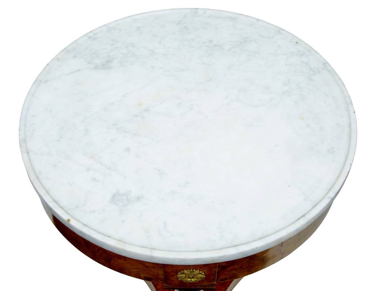Late 19th century Empire influenced round birch marble top occasional table

Dish top marble small centre table, circa 1880.

Standing on three columns with ormolu mounts.

Measures: Height 28 3/4
