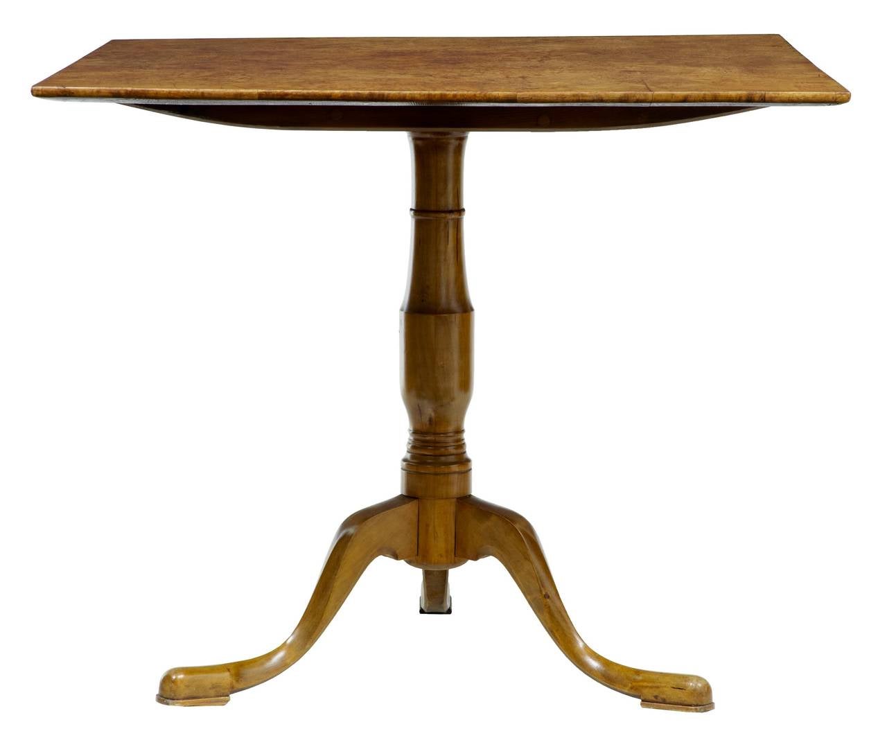 Swedish tilt top table, circa 1840 

Stunning colour and grain on the top. Standing on turned tripod base, terminating on pad foot.

Measures: Height 30