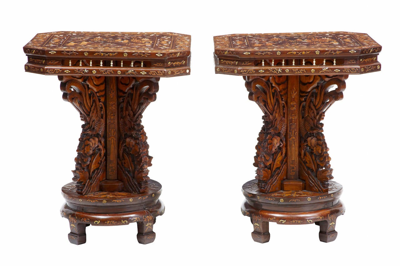 Pair of 19th century Chinese hardwood inlaid occasional tables 

Rare pair of Chinese occasional tables, circa 1870

Profusely inlaid tops, depicting traditional Chinese scenes, bats, dragons, animals and florals.

Central column with four