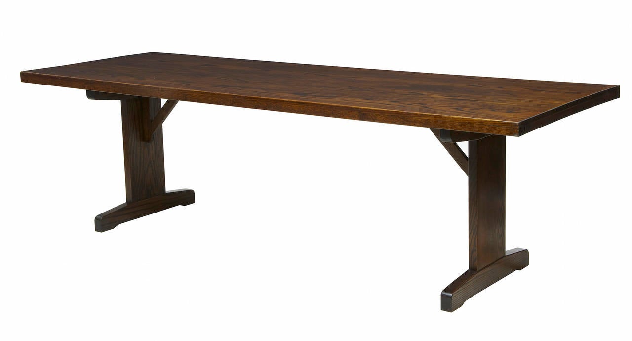 1960's oak table of modern design. 

Trestle ends.

HEIGHT: 29