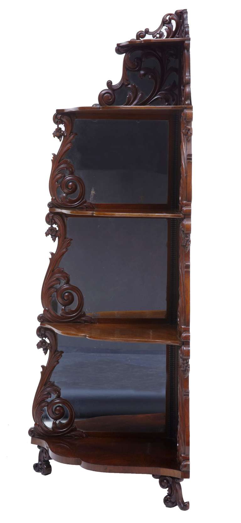 19th century carved mahogany Victorian whatnot

Good quality five-tier carved mahogany what not with mirrored back panels.