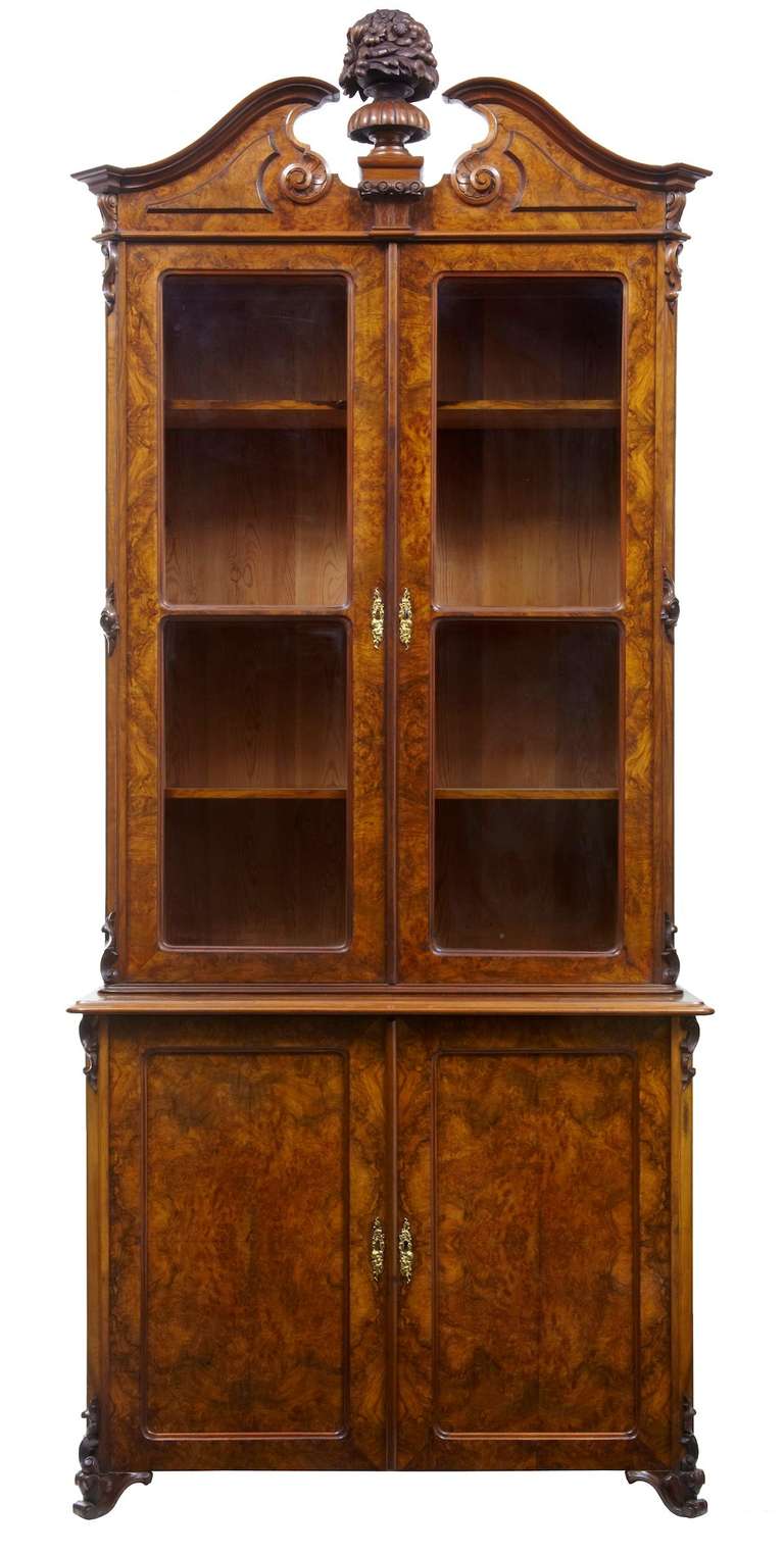 Stunning 19th century bookcase in burr walnut with original glass Locks original and with a original key. Three shelves so this could hold four rows of books if needed another shelve could be made making this hold five rows of books.