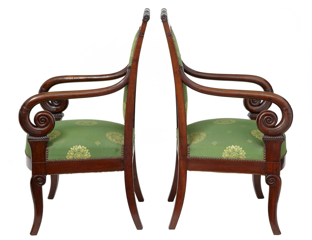 Superb pair of French empire armchairs circa 1830. 

Carved details on the back and scrolled arms. Upholstery in good order.