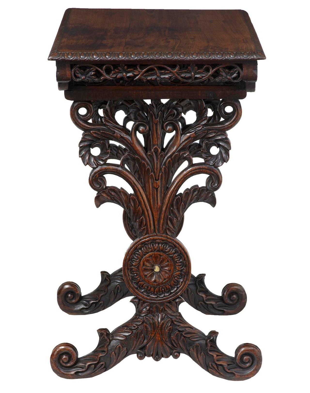 Heavily carved Anglo Indian table circa 1850. 

Single compartmented drawer. Carved supports and stretcher.