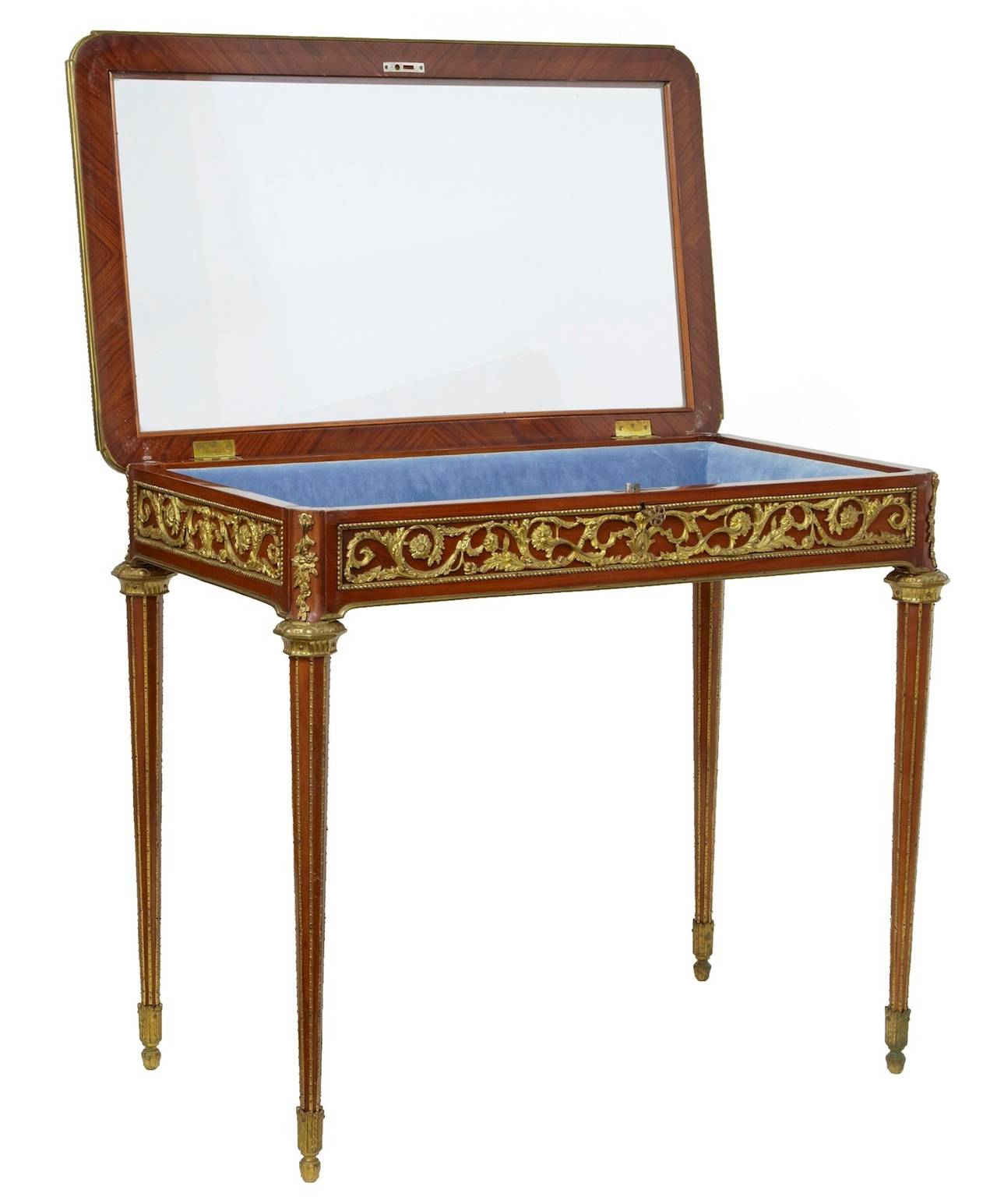 Ormolu mounted French bijouterie table circa 1920 

Made in kingwood with glass top, which opens to reveal a blue velvet padded display compartment.