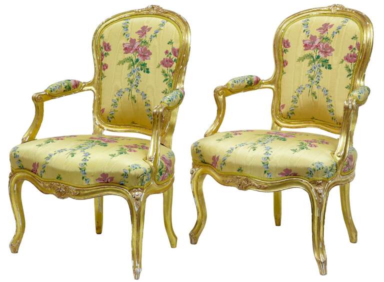 Near pair of 18th century Louis XV French gilt fauteuil armchairs by Claude Etienne Michard

Fine pair of classical fauteuil armchairs, one stamped Michard, circa 1770
Upholstered in fine quality silk
Distressing to gilding

Measures: Height